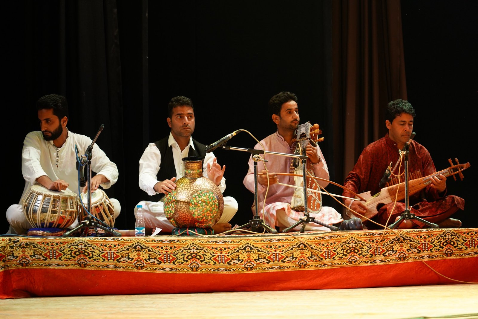 Kashmiri ensemble performing on a theatre stage