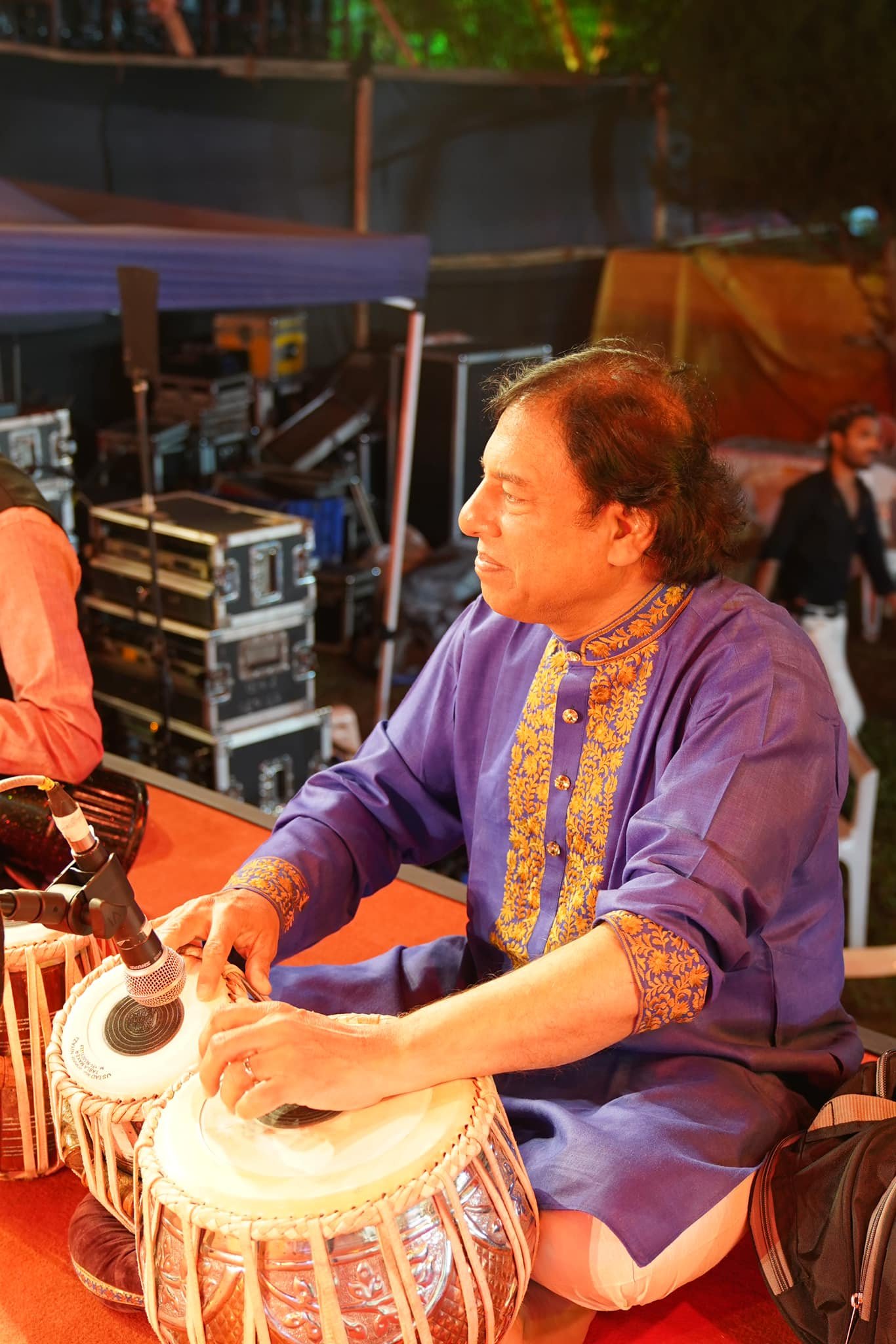 Tabla accompanist in a Kashmiri embroidered kurta before a concert
